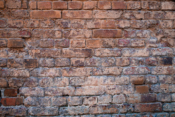 Fototapeta premium Texture of old brickwork with peeling color paint