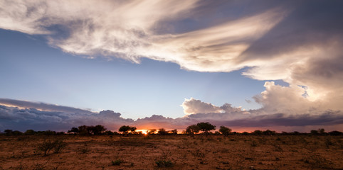 african sunset in namibia wide panorama with cloud formation