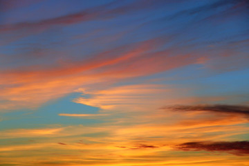 Orange sunset before night. Twilight with bright sunset. Evening landscape