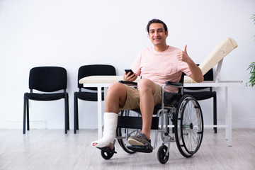 Young injured man waiting for his turn in hospital hall