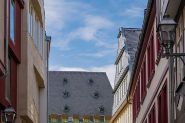 Outdoor view of historical building with classical gamble roof, simple rectangular windows and exterior timber facade, at new old town, Neue Altstadt, in Frankfurt, Germany. 