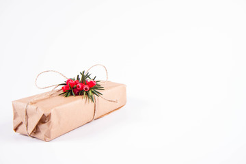 Gift decorated with a gunny string bow and with a common yew twig 