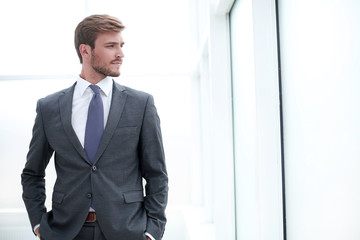 close up. focused young businessman standing in office