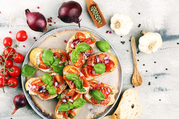 fresh tomato bruschetta. italian food appetizer with basil on table