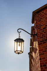 Fototapeta na wymiar Classic street lamp in the sun