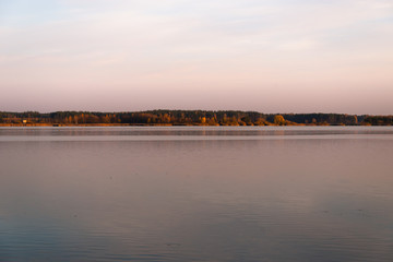 Lake at sunset. Calm scenery