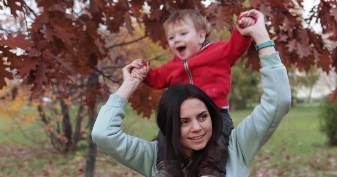 Infant boy in mother s arms indulges