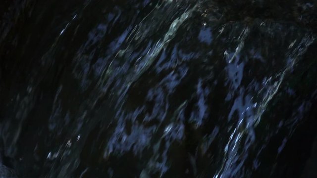 Closeup of fresh water stream in slow motion.
