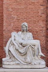 Fototapeta premium Replica of Miguel Angel's famous sculpture the Pieta at Adolfo Suarez park of torrejon de ardoz, madrid, spain