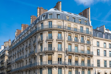 Fototapeta na wymiar Paris, parisian facade in a chic area, typical balcony and windows