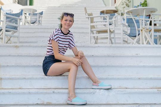 Summer city portrait trendy teenage girl 15 years old in city