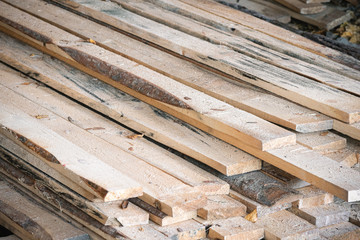Wooden boards on the floor of a house under construction.