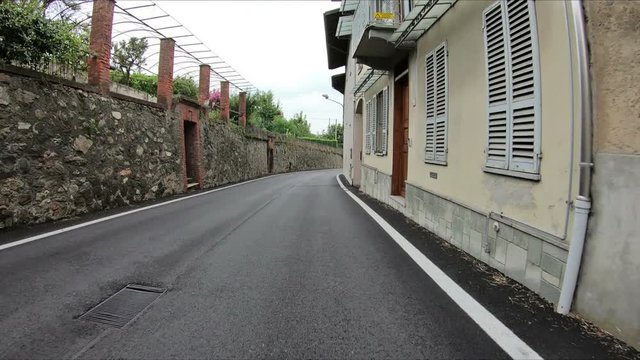 paved road passing through Piverone town, Torino, region Piemonte, Italy