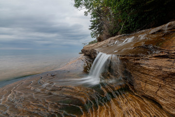 waterfall in forest by sea