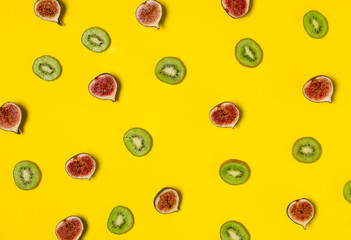 Figs and kiwi patterns isolated on yellow background
