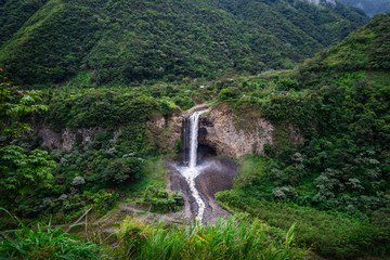 Huge waterfall in the middle of a humid forest. Holy water baths. Ecuador