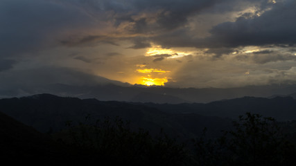 Sunset at the Vilcabamba Valley. Sun is hiding behind the mountains. Loja, Ecuador