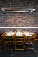 Lunch table with brick wall background 