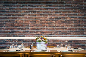 Lunch table with brick wall background 