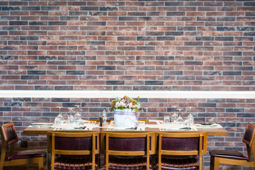 Lunch table with brick wall background 
