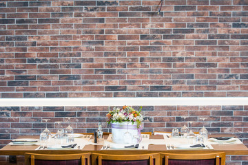 Lunch table with brick wall background 