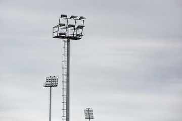 Obraz premium Sports stadium light tower during the day