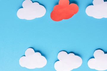 White paper clouds on blue background. Cloud computing concept. Copy space
