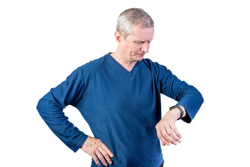 An elderly man measures the pulse of a fitness bracelet. Isolated on a white background.
