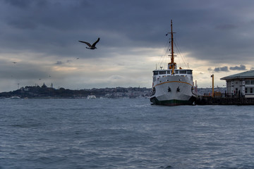 In Istanbul, ferries operate on the Bosphorus line. Traditional old steamers. Cloud weather in the background.