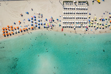 Aerial view of San Vito Lo Capo,Sicily white sand beach. Sun loungers, umbrellas and the sea, view from a quadrocopter - Powered by Adobe
