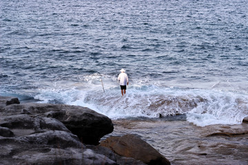 Man Sea Fishing In Waves