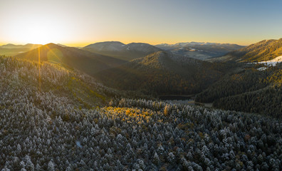 AERIAL: Flight Over Foggy Autumn Colourful Forests.