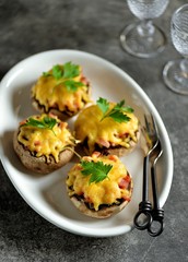 Stuffed mushrooms with smoked meat, fried onions and hard cheese.