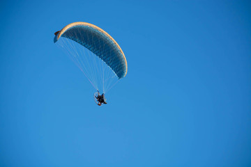 Paraglider in the blue skies