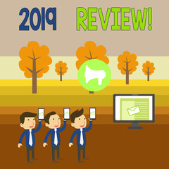 Writing note showing 2019 Review. Business concept for remembering past year events main actions or good shows SMS Email Marketing Media Audience Attraction PC Loudspeaker