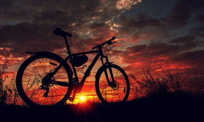Fototapeta premium bike in the background fire sunset.