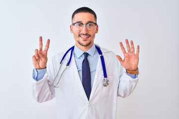 Fototapeta na wymiar Young doctor man wearing stethoscope over isolated background showing and pointing up with fingers number seven while smiling confident and happy.