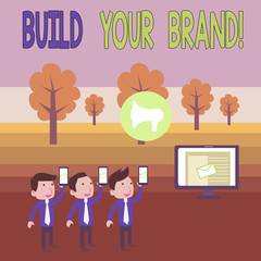 Writing note showing Build Your Brand. Business concept for creates or improves customers knowledge and opinions of product SMS Email Marketing Media Audience Attraction PC Loudspeaker