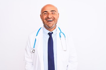 Middle age doctor man wearing stethoscope and tie standing over isolated white background with a...
