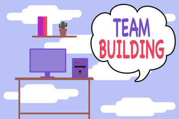 Conceptual hand writing showing Team Building. Concept meaning various types of activities used to enhance social relations Desktop computer with wooden table shelf books flower pot