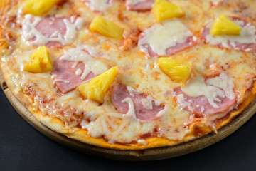 Hawaiian Pizza isolated on black