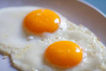 fried eggs sunny side up on  a plate