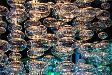 Close-up bubble chandelier ceiling light with selective focus.