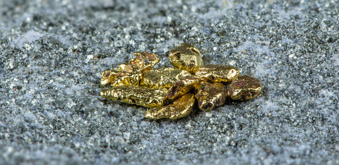 Macro shot of natural gold nuggets. Concept: natural gold