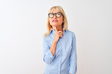 Middle age businesswoman wearing elegant shirt and glasses over isolated white background Thinking concentrated about doubt with finger on chin and looking up wondering