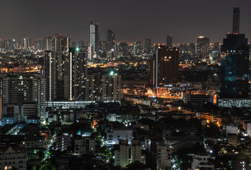 Sky view of Bangkok with skyscrapers in the business district in Bangkok In the night beautiful twilight give the city a modern style.