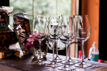Glasses for alcohol and wine are on the bar in a restaurant or cafe before dinner, a romantic date on the weekend.