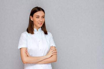 female doctor in white coat studio portrait