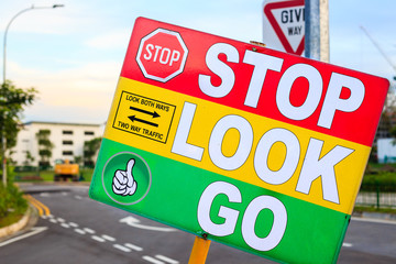 colorful pedestrian safety sign board closeup detail view