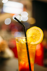 Ice lemon tea with ice in a glass in night